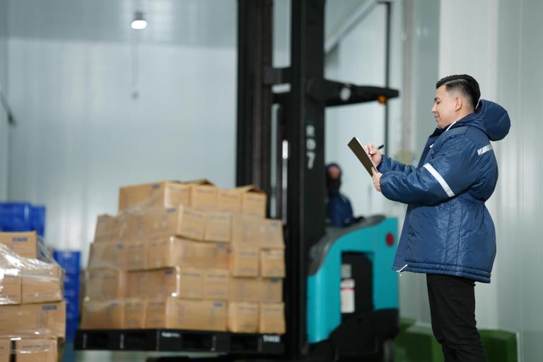 Inside the Artico Cold Chain facility. Area Operations Manager Francis Olivares ensuring quality and accuracy. 