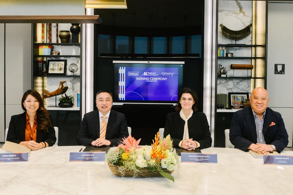 Representatives gather for the official signing ceremony, marking the start of a new partnership between ALI and Hilton