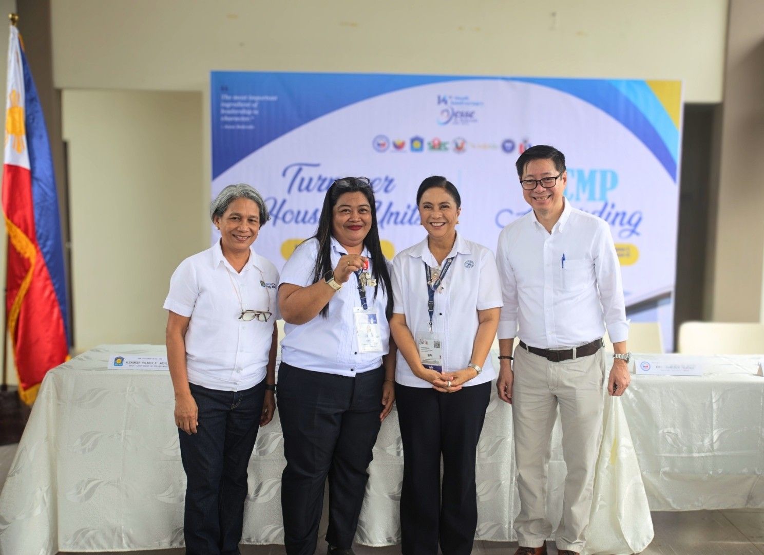 Naga City Mayor Leni Robredo (Center), Pag-IBIG Fund President and CEO Marilene Acosta (Left), and Ayala Land Group Head of Strategic Growth and New Ventures and Chief Sustainability Officer Robert S. Lao (Right) led the ceremonial turnover of keys to the first 110 Naga City government employees under the 1,011-home housing program at BellaVita Naga in Barangay Pacol on Aug. 18, 2026
