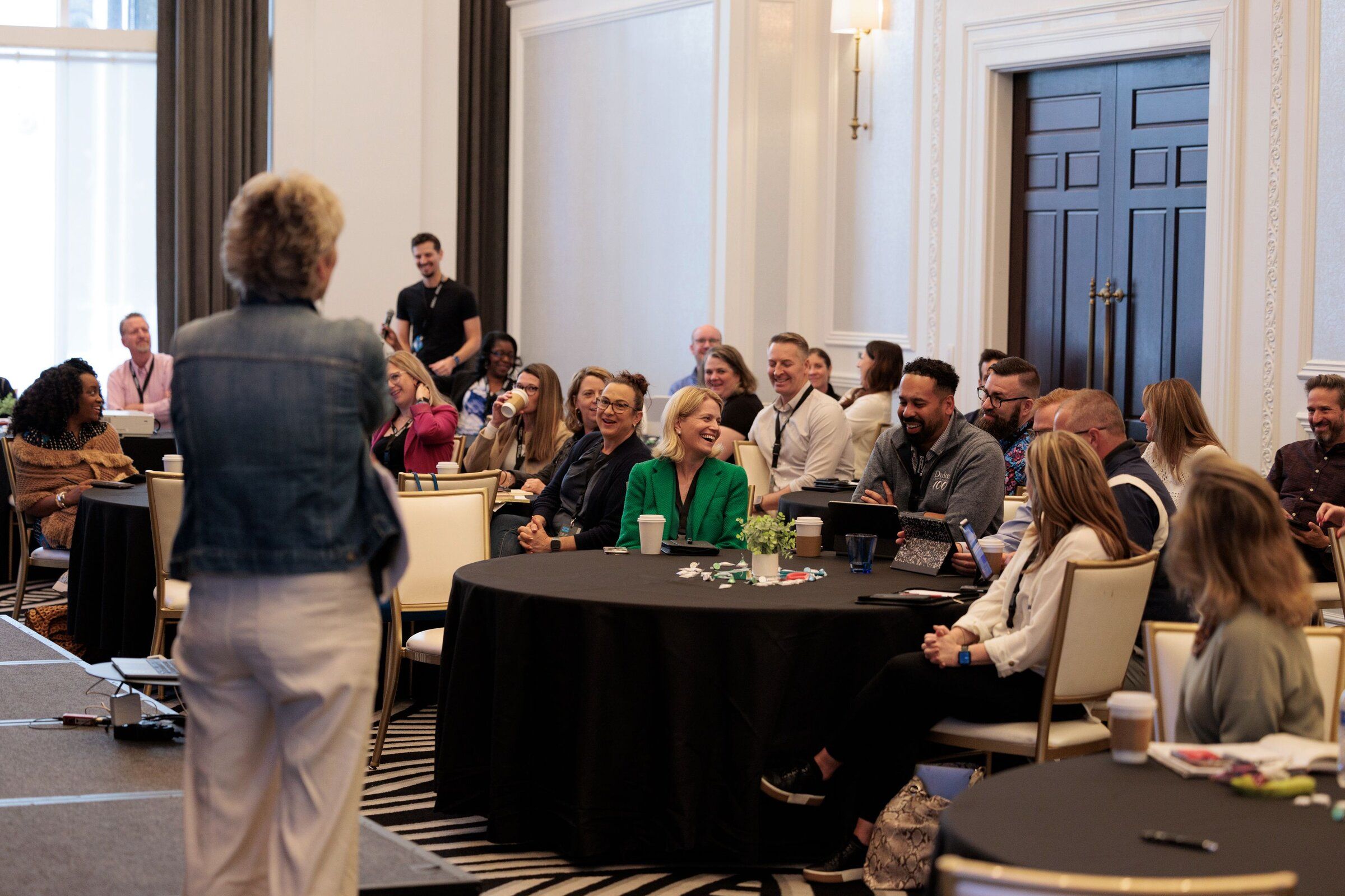 A CMOLab 2025 session with attendees in discussion