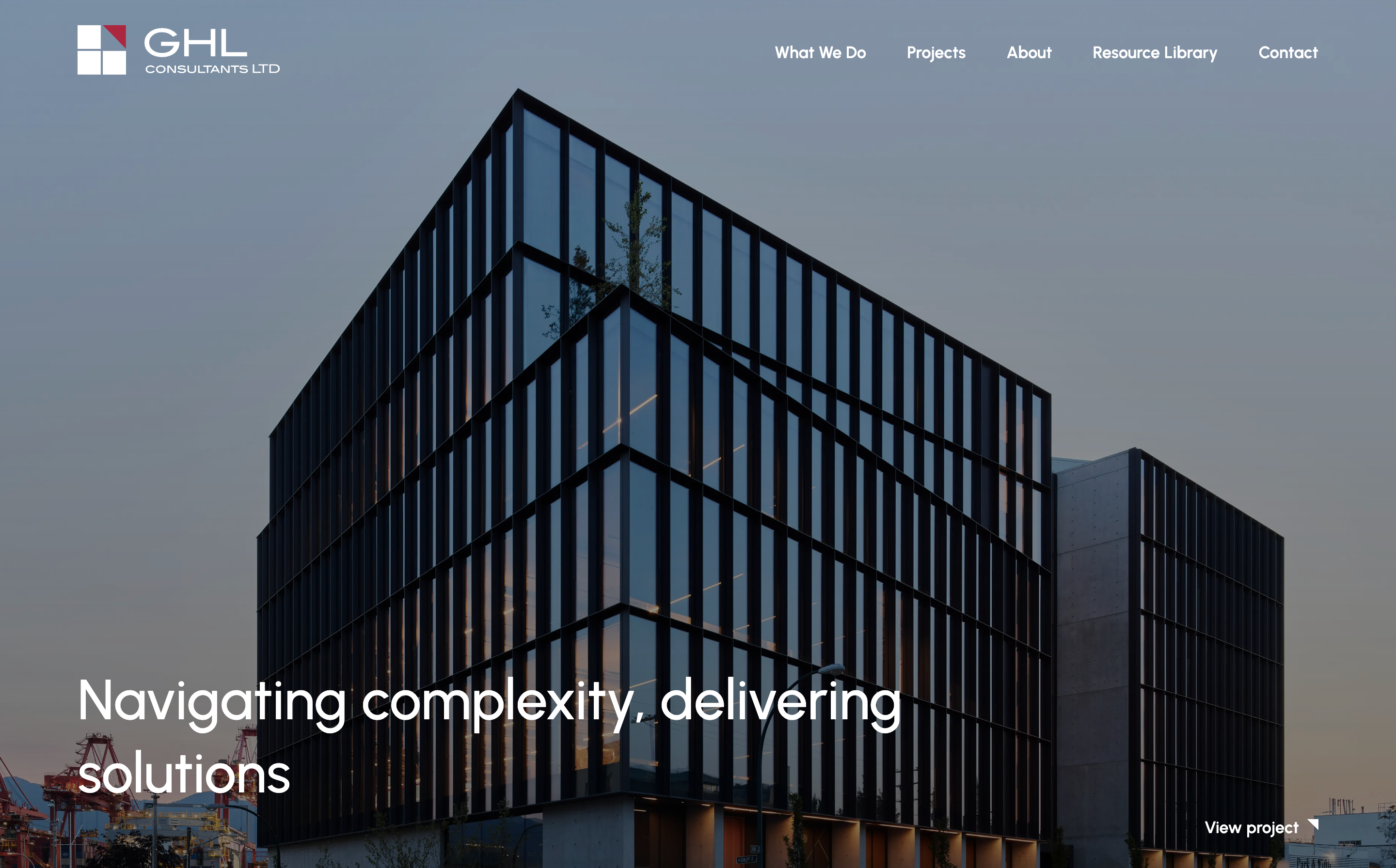 Redesigned homepage for GHL Consultants featuring a large background image of a modern building with the heading, 'Navigating complexity, delivering solutions'