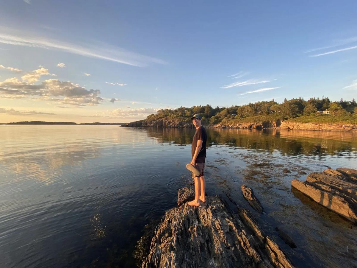 Standing on a rock near the ocean