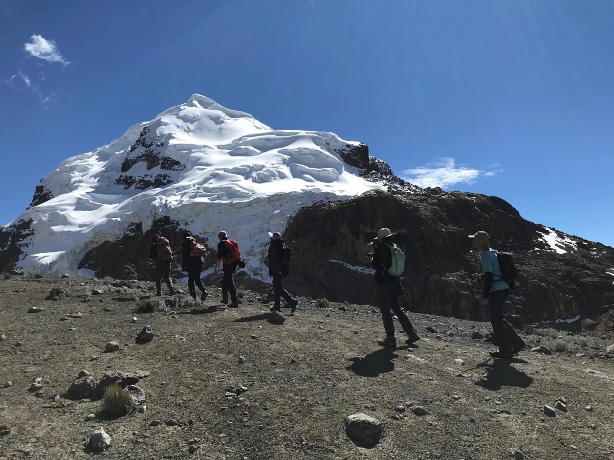 Hiking near the top of a snow capped peak