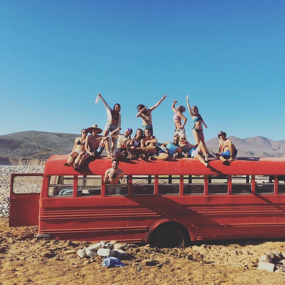 Group photo from on top of the red Baja school bus