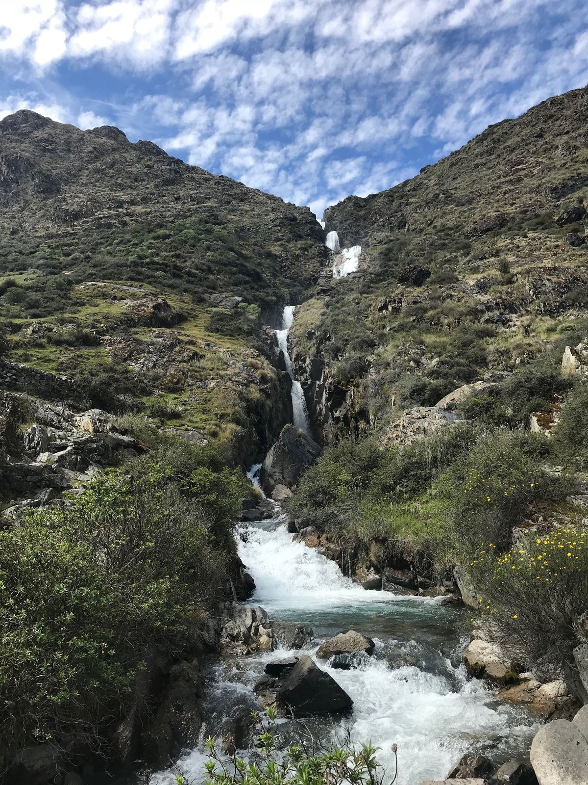 A waterfall cascading into a valley