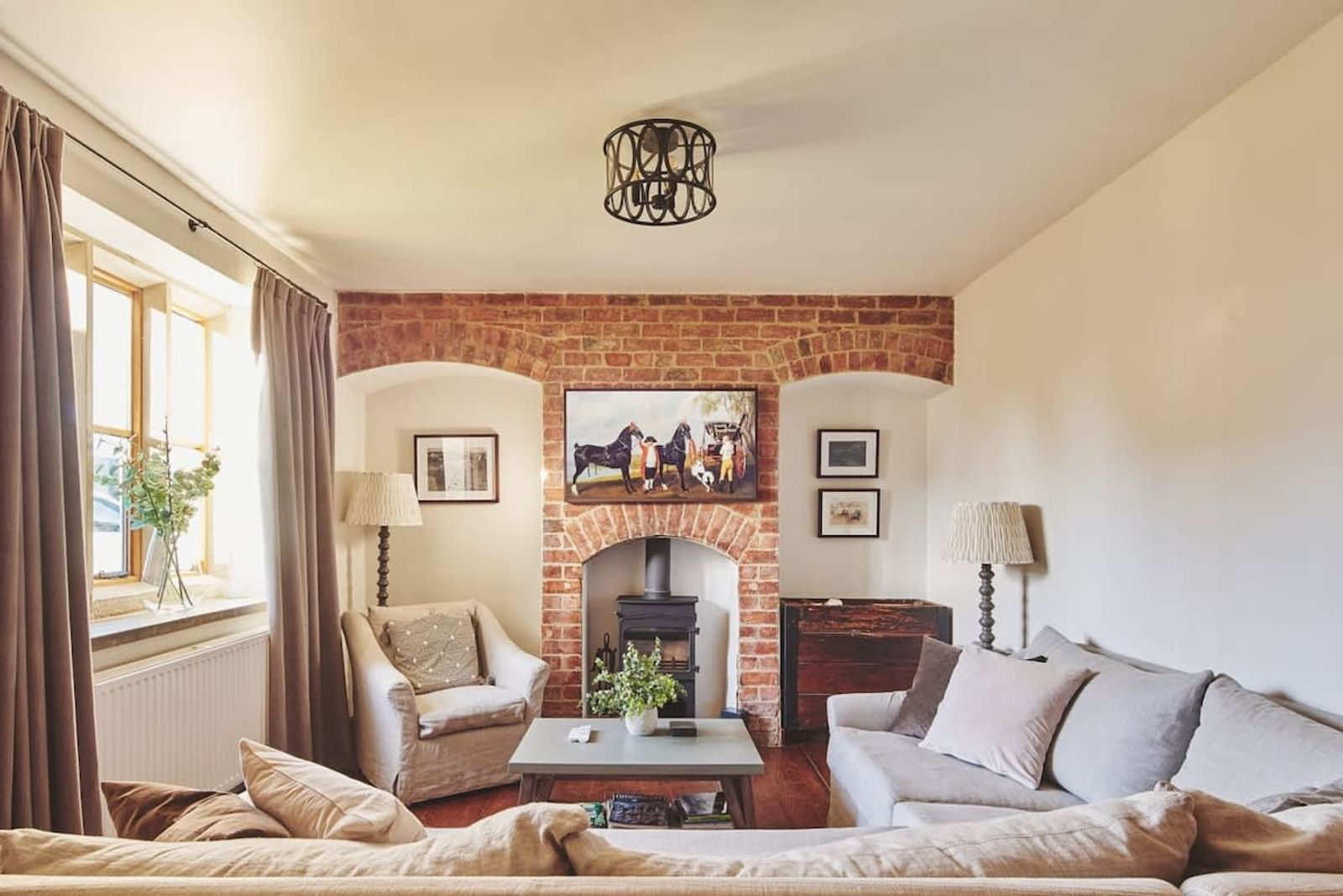 Gorgeous cosy lounge with log burner, smart TV, sofa, French polished wooden floors 