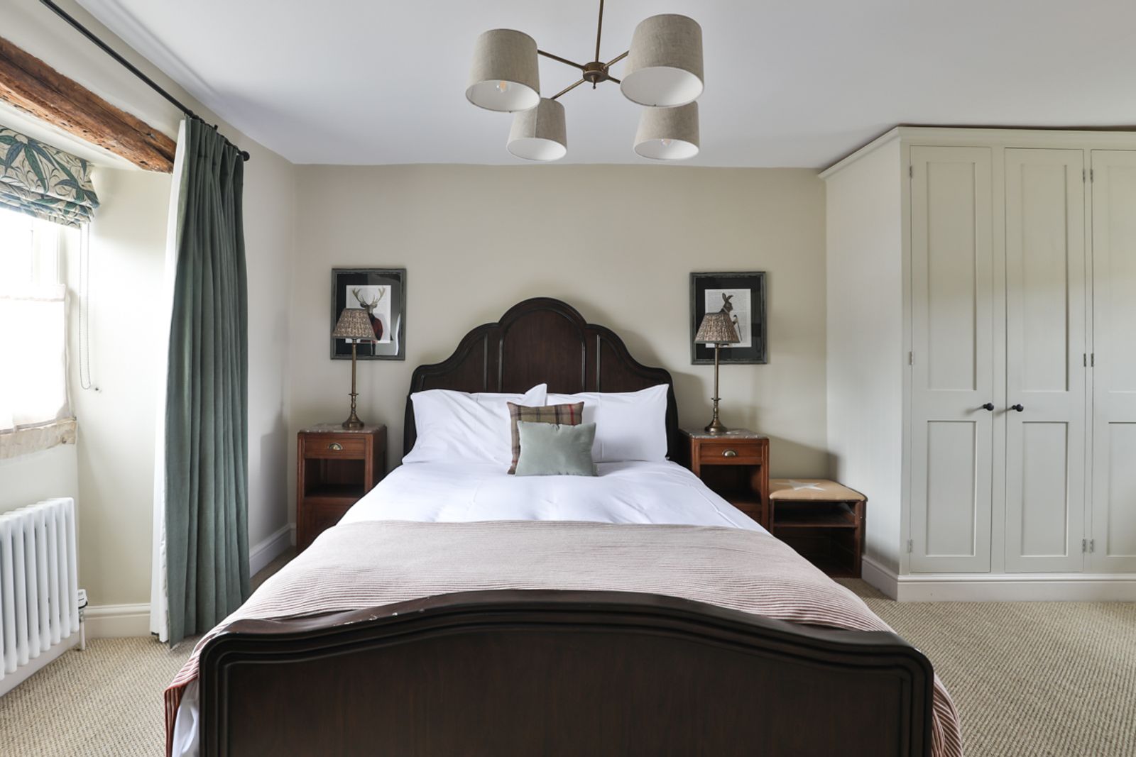 Bedroom with double bed, wardrobe and natural light