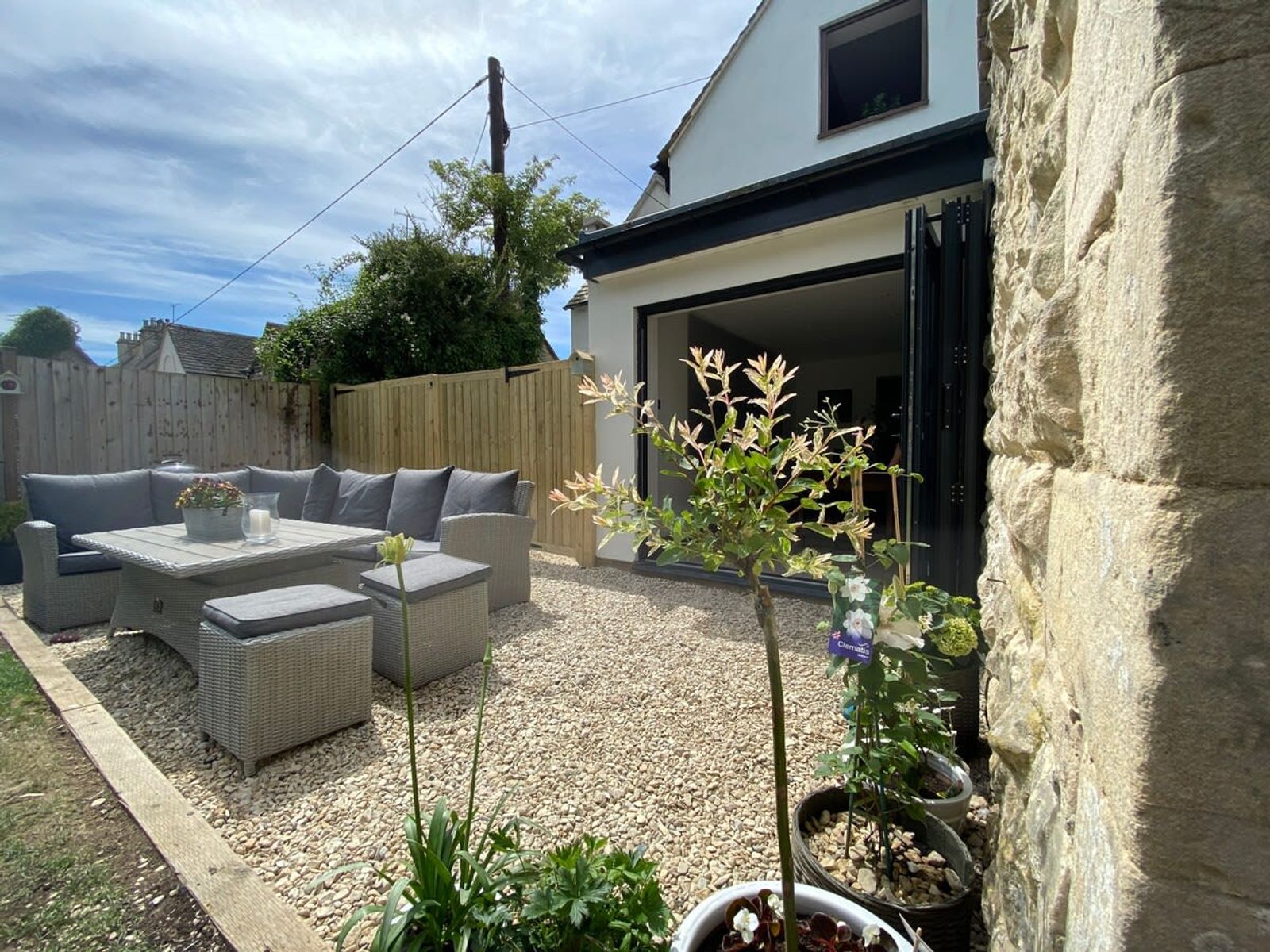 Large spacious garden with barbecue seating area and lawned secure garden for dogs. 