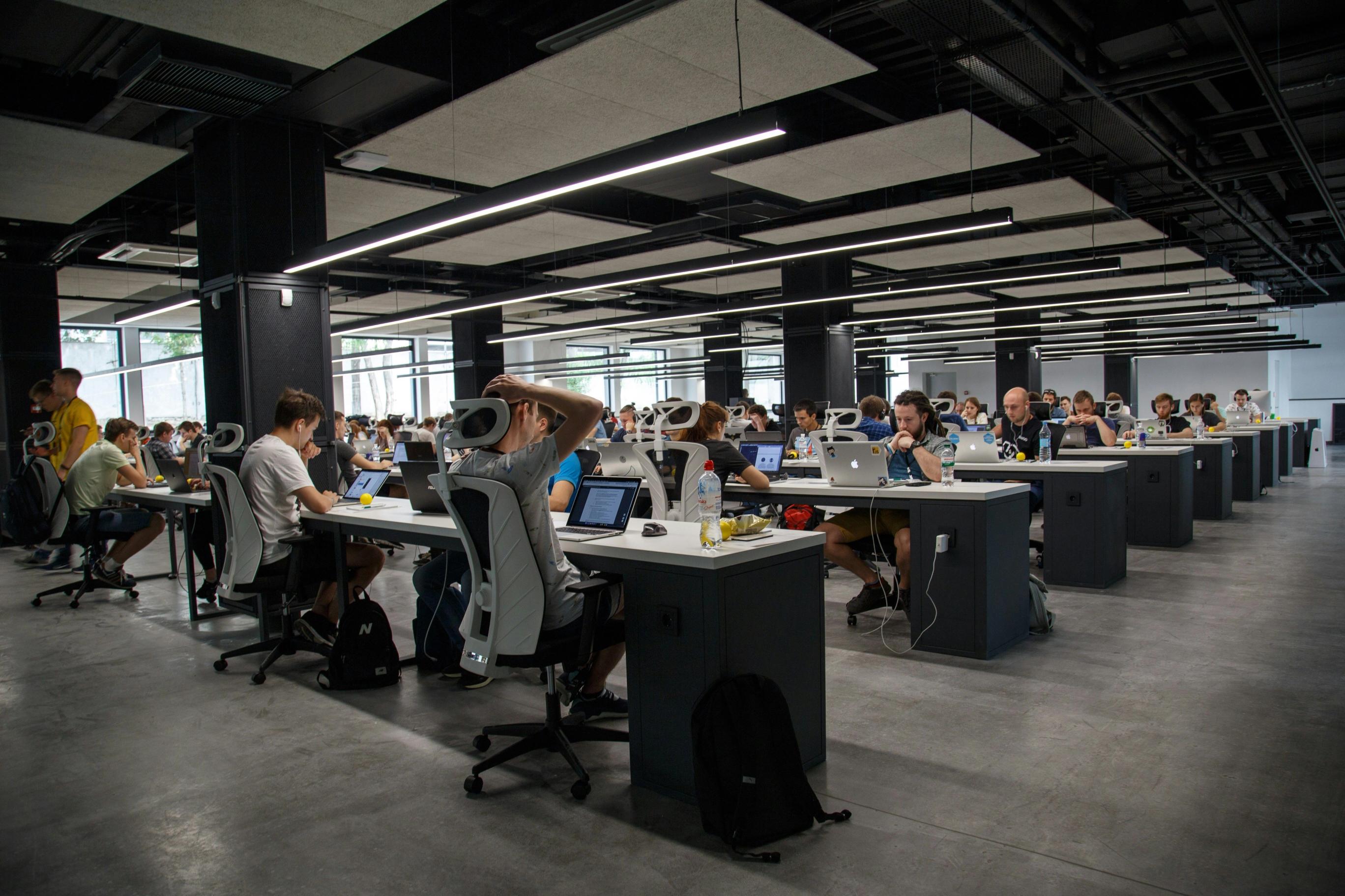 People working remotely together at share-space office, looking focused