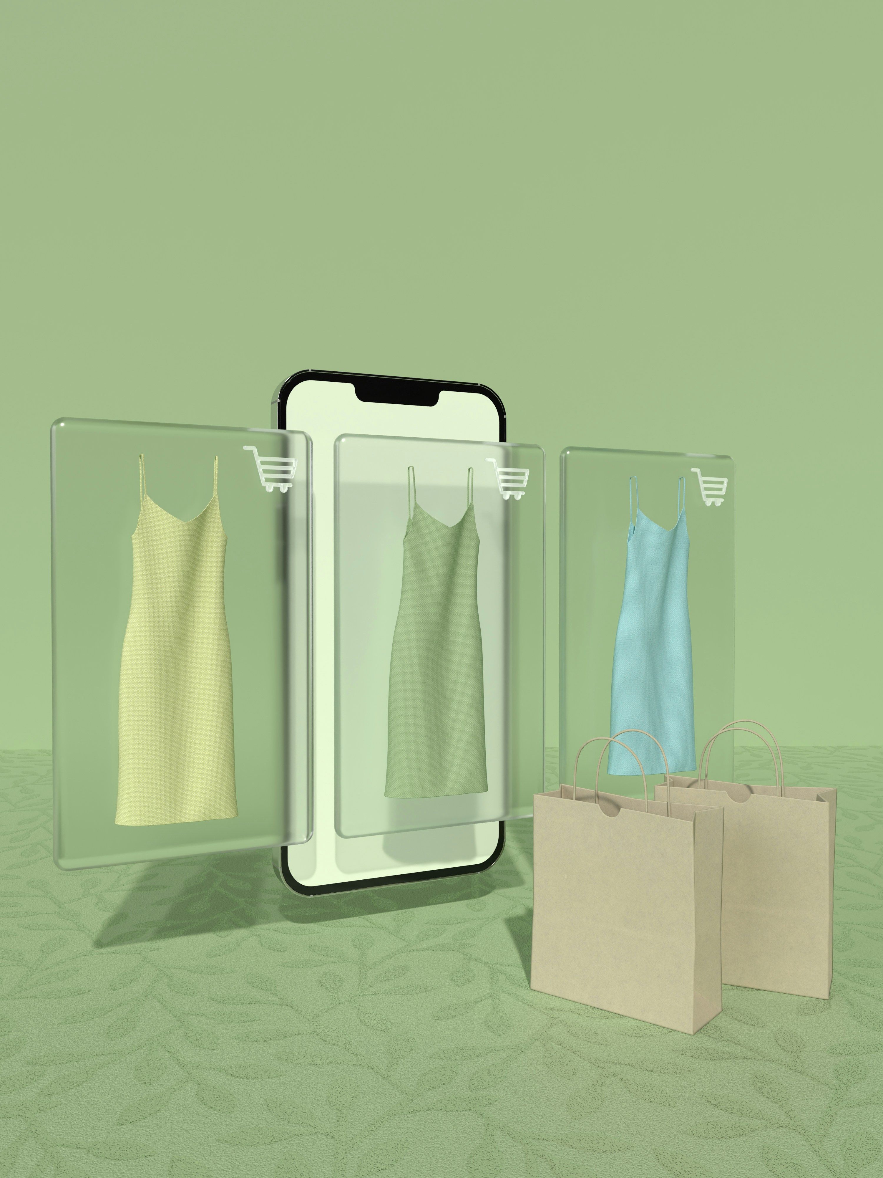 Digital shopping concept with dresses displayed on a smartphone screen and shopping bags in front.