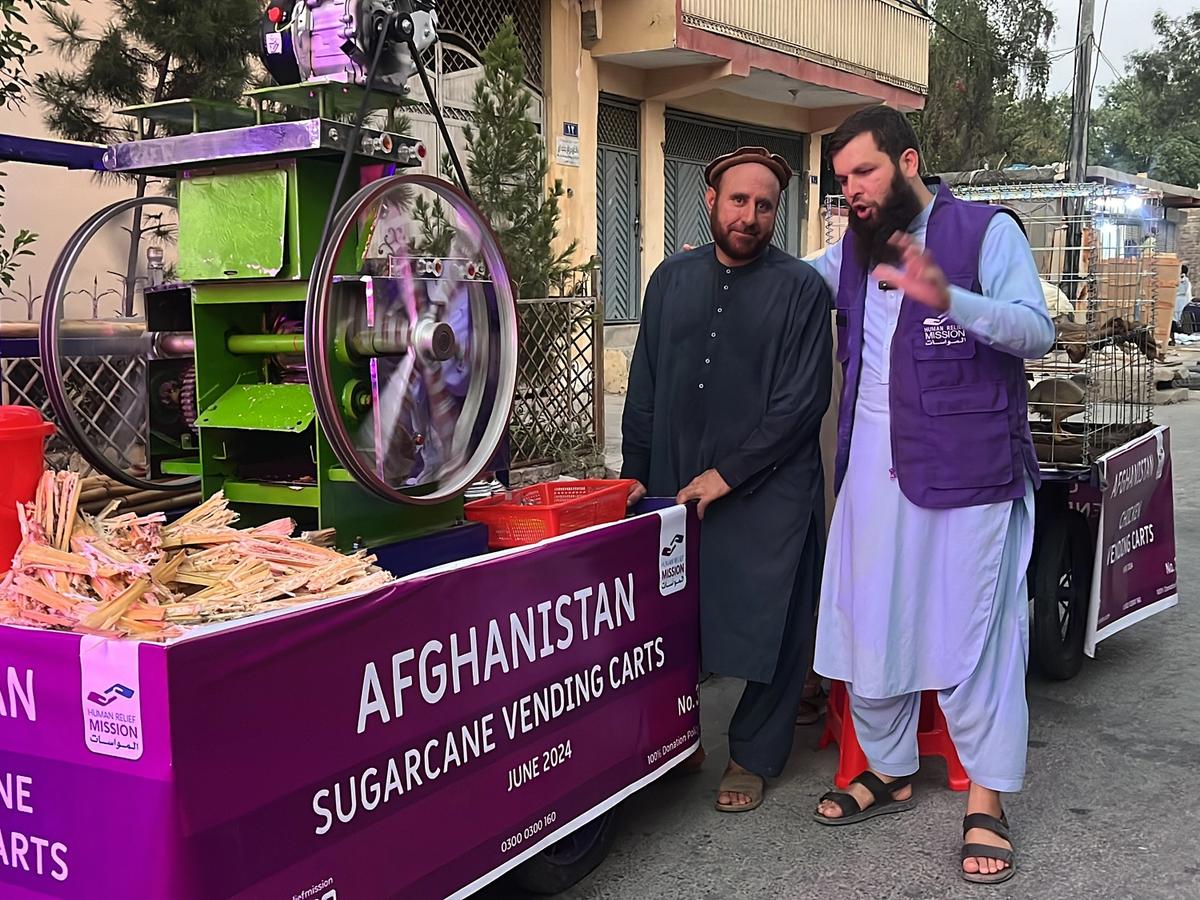 Man in Afghanistan with his Sugarcane Cart with Human Relief Mission Aid Worker | Human Relief Mission