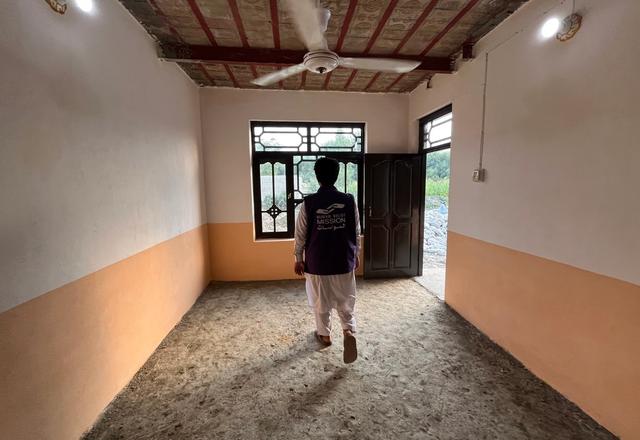 HRM Charity Aid Worker walking in Afghanistan Orphanage | Human Relief Mission