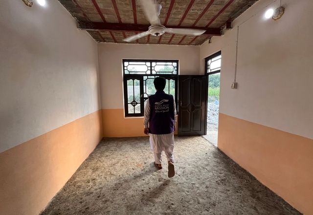 HRM Charity Aid Worker walking in Afghanistan Orphanage | Human Relief Mission