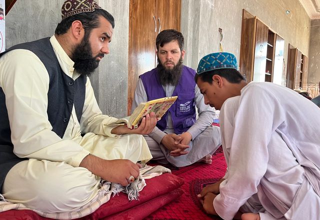 Child in Afghanistan Reciting Quran in Front of Teacher | Human Relief Mission