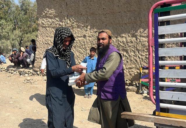 Afghanistan local receiving Hygiene kit from HRM Aid Worker | Human Relief Mission