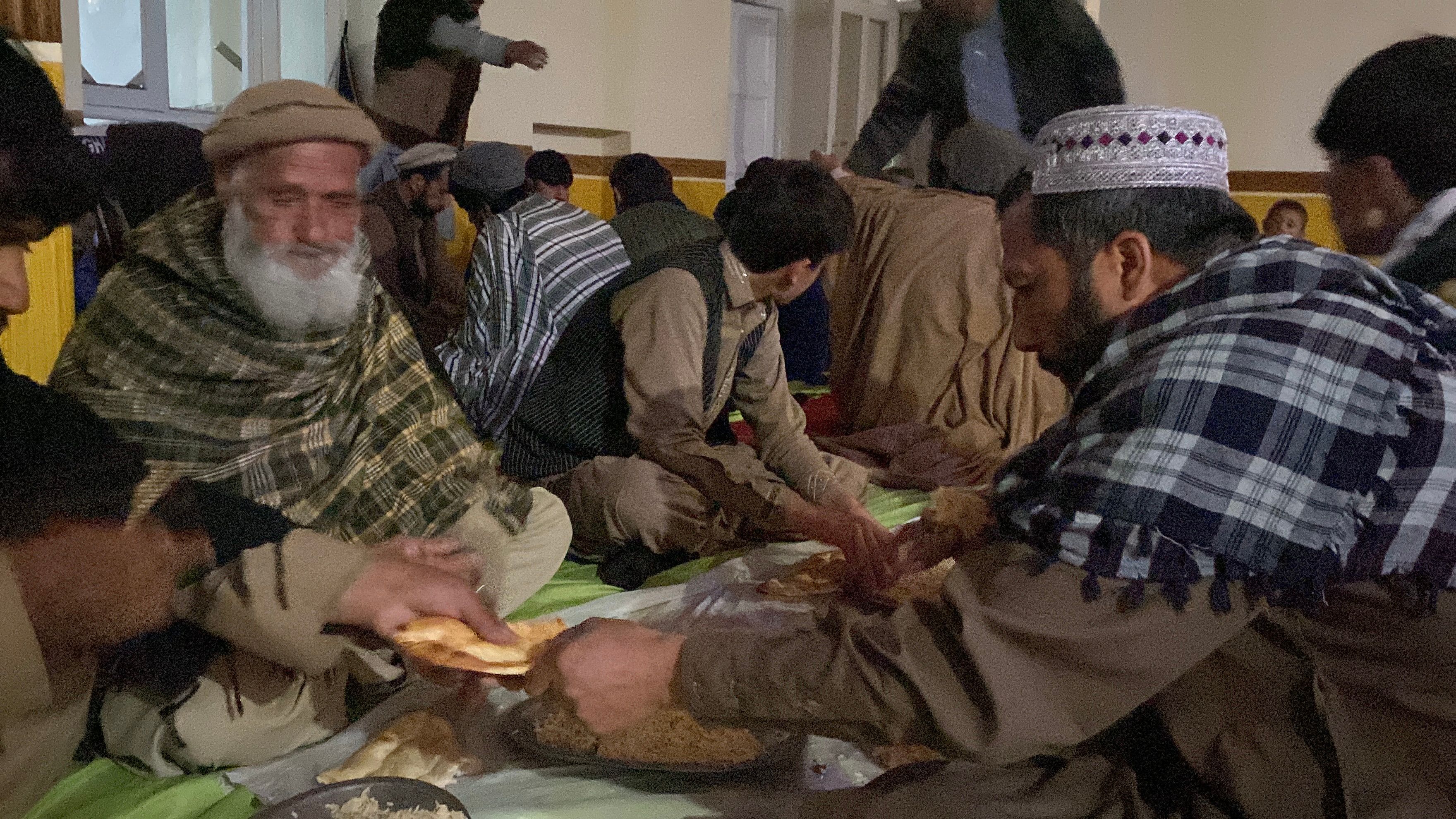 Afghan families eating