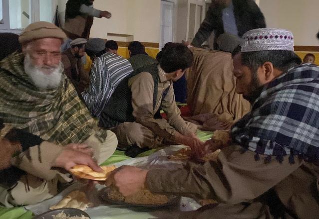 Afghan families eating