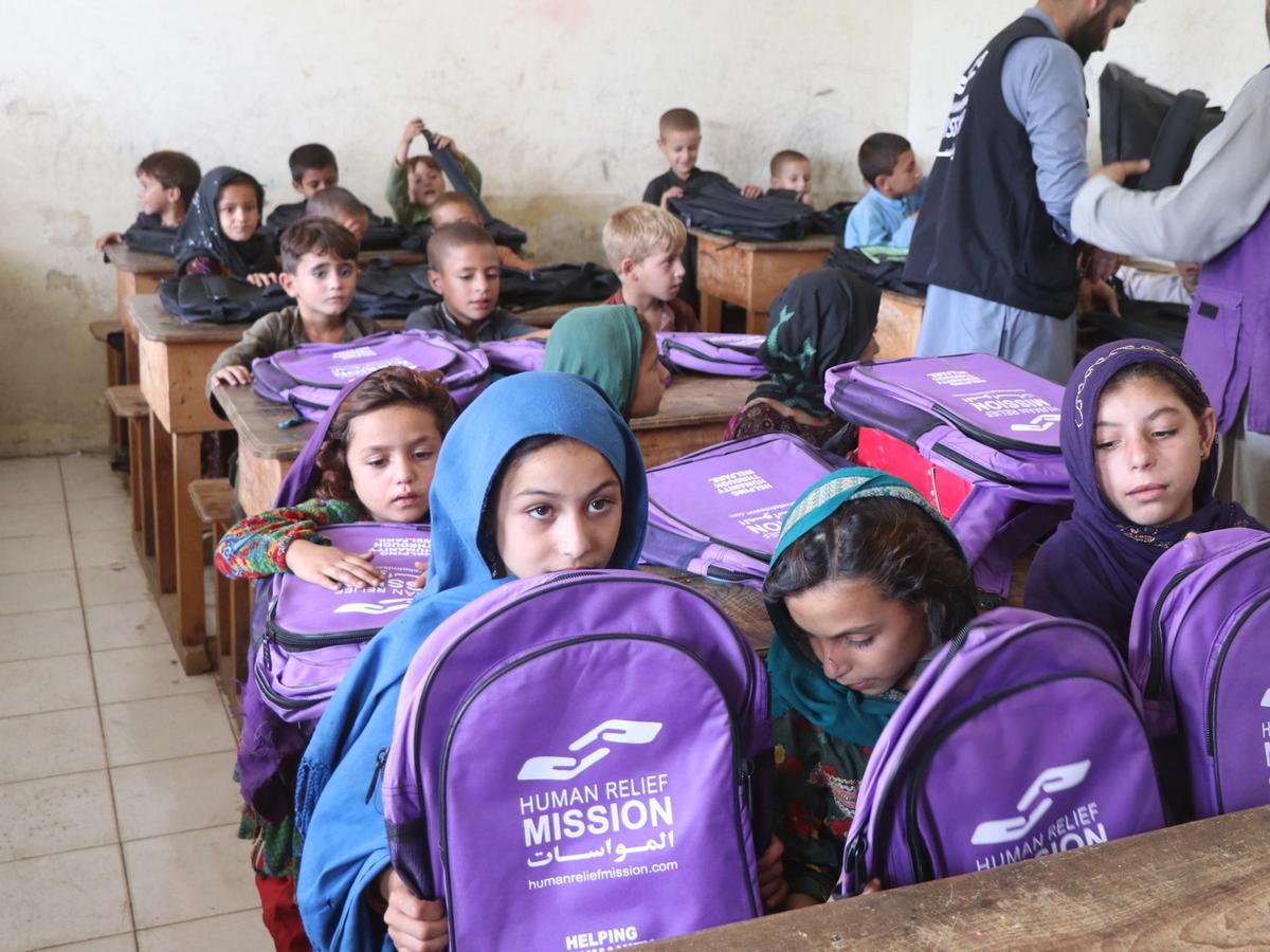 Students in Afghanistan school receiving bags with stationary and books | Human Relief Mission
