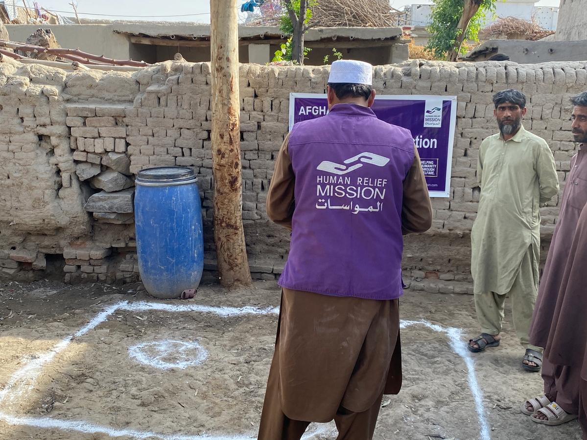 HRM Charity Aid worker helping to build a water well | Human Relief Mission