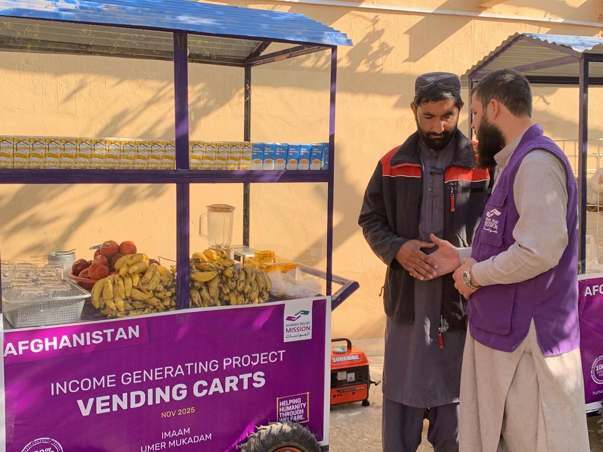 Afghan man with his Fresh Juice cart (IGP) with Human Relief Mission aid worker