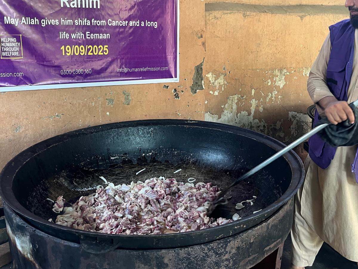 HRM Charity Aid Worker Preparing Hot Meals | Human Relief Mission