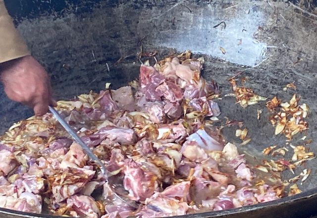 Meating getting cooked in a Wok