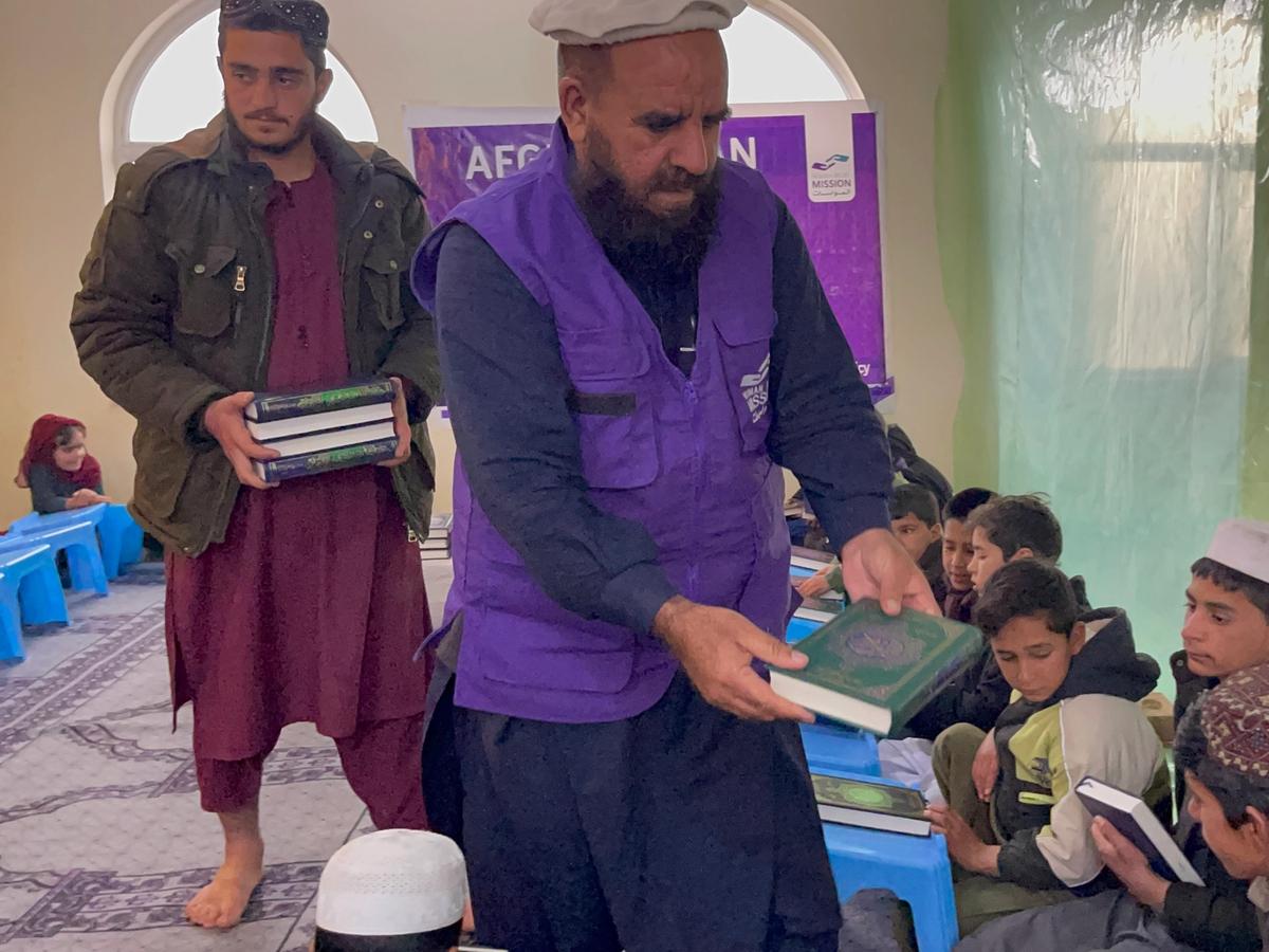 HRM Charity Aid Worker Distributing Quran in a Masjid | Human Relief Mission