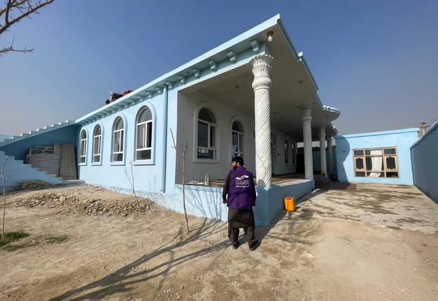 HRM Charity Aid Worker in front of a masjid in Afghanistan | Human Relief Mission