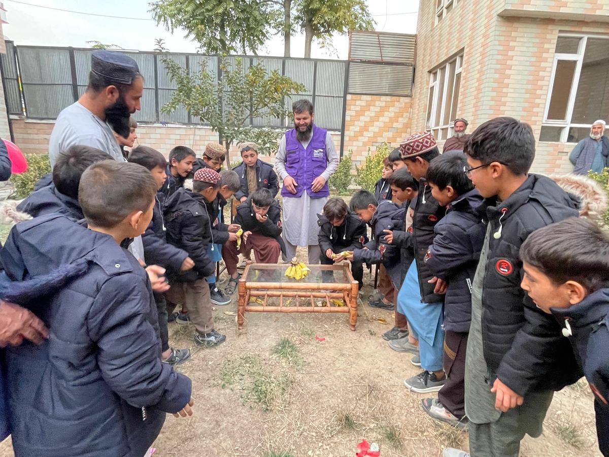 HRM Charity Aid Workers with orphans | Human Relief Mission