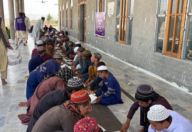 A Community in Afghanistan Eating Hot Meals | Human Relief Mission