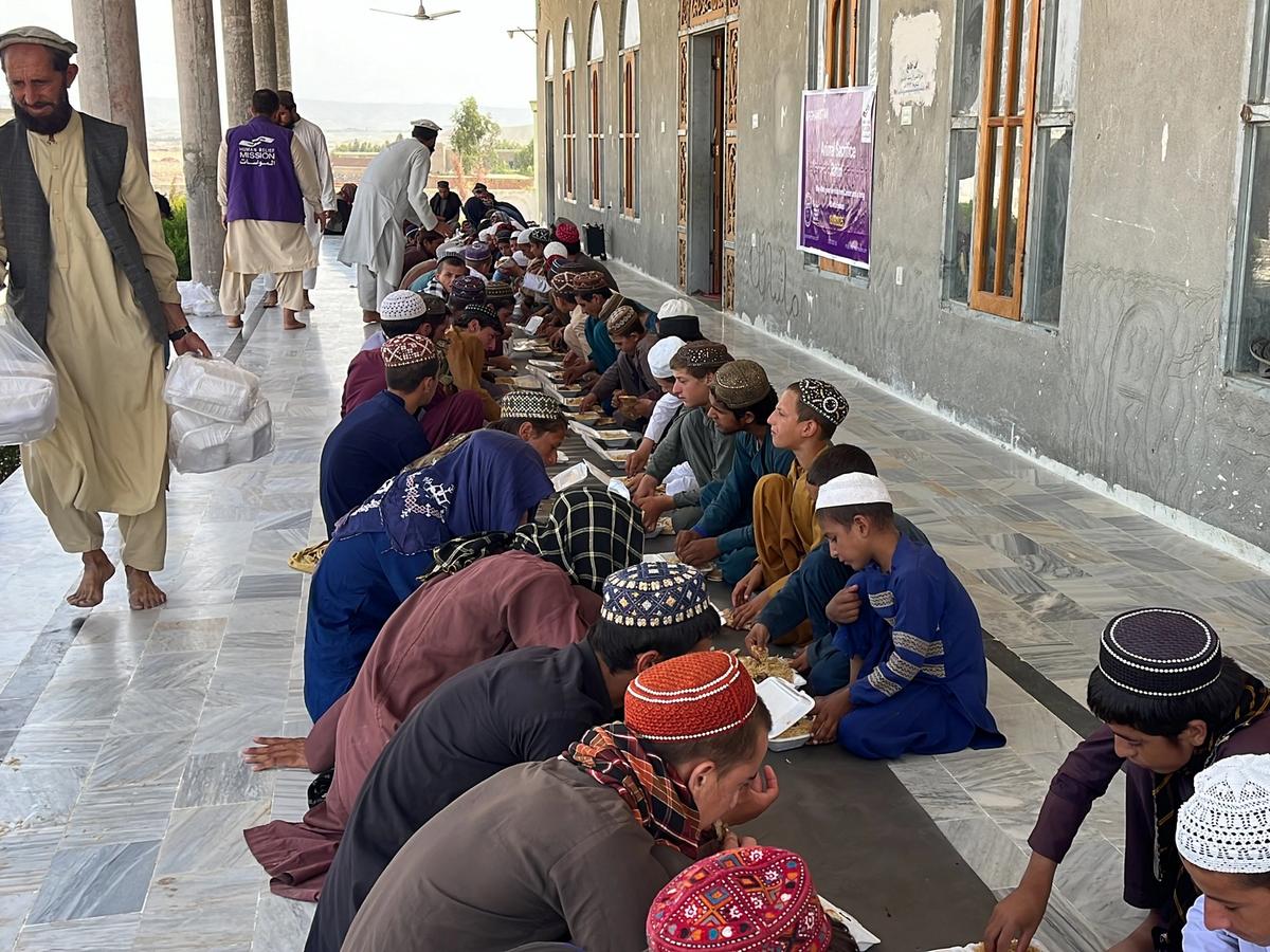 Community in Afghanistan Eating Hot Meals | Human Relief Mission