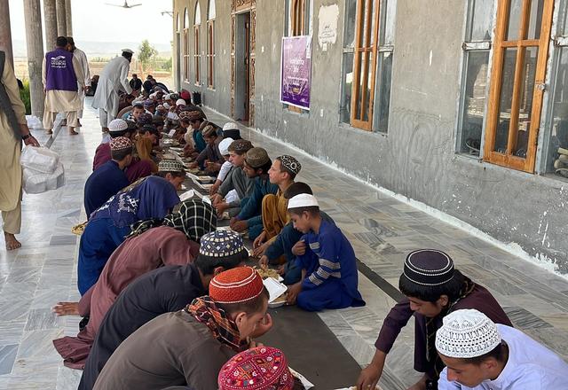 A Community in Afghanistan Eating Hot Meals | Human Relief Mission