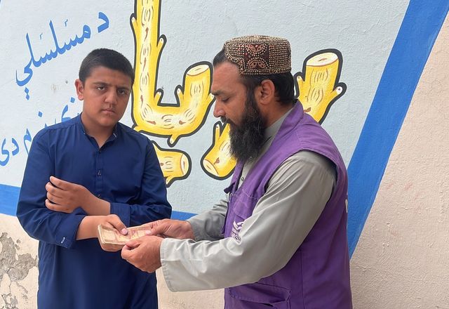Cash Given to a family in Afghanistan by HRM Charity aid Worker | Human Relief Mission