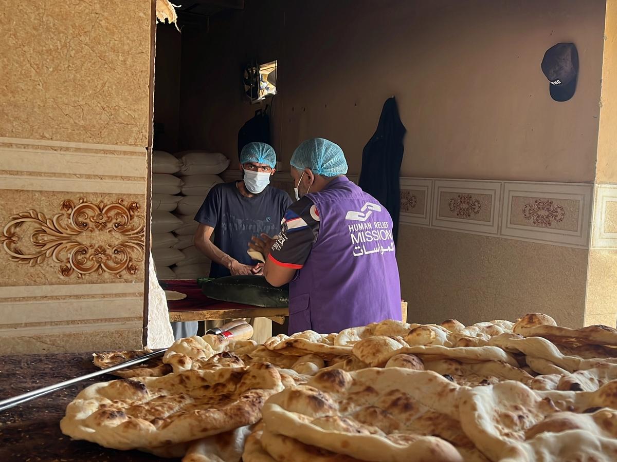 HRM Charity Aid Worker preparing fresh bread in the bakery | Human Relief Mission