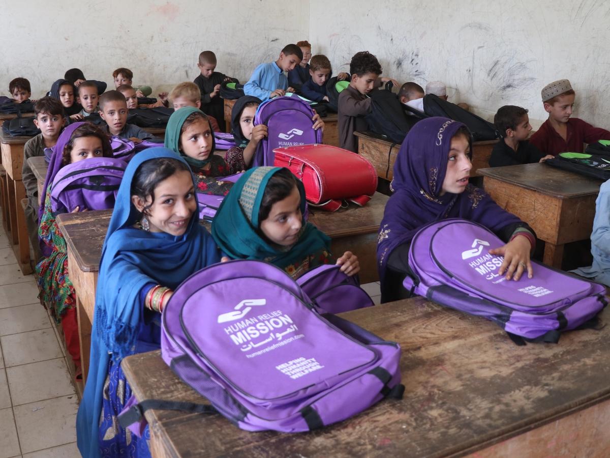 Students in Afghanistan school receiving bags with stationary and books | Human Relief Mission
