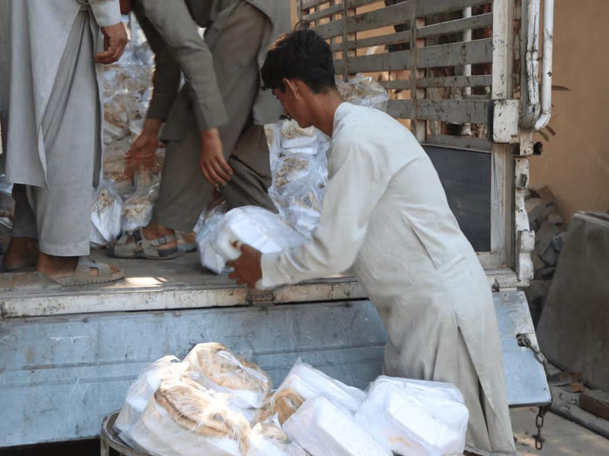 Fresh hot meals being loaded on a truck in Afghanistan | Human Relief Mission