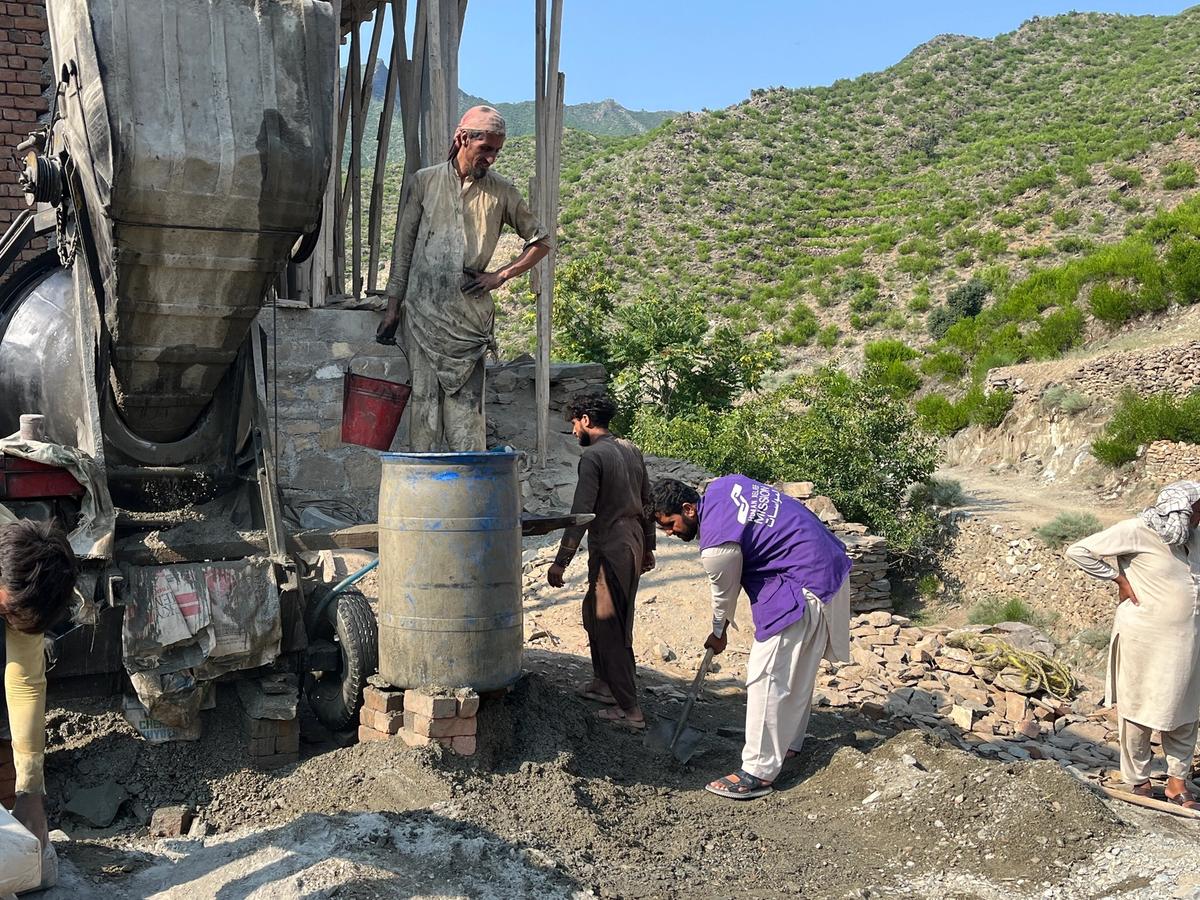 Locals in Afghanistan and HRM Charity Aid Worker constructing a masjid | Human Relief Mission