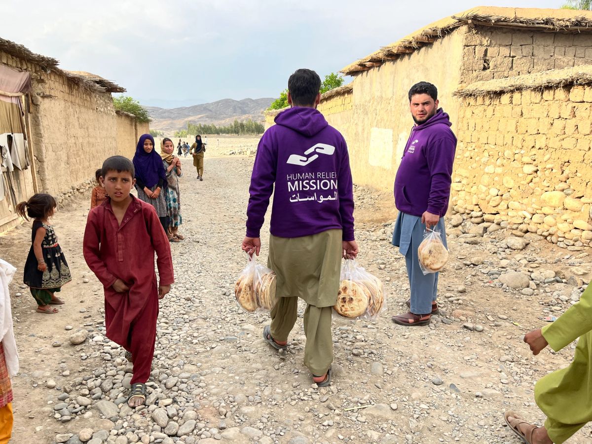 HRM aid workers distributing fresh bread