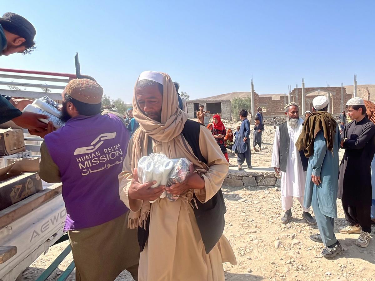 HRM Aid Worker providing hygiene kits to the Afghan community | Human Relief Mission