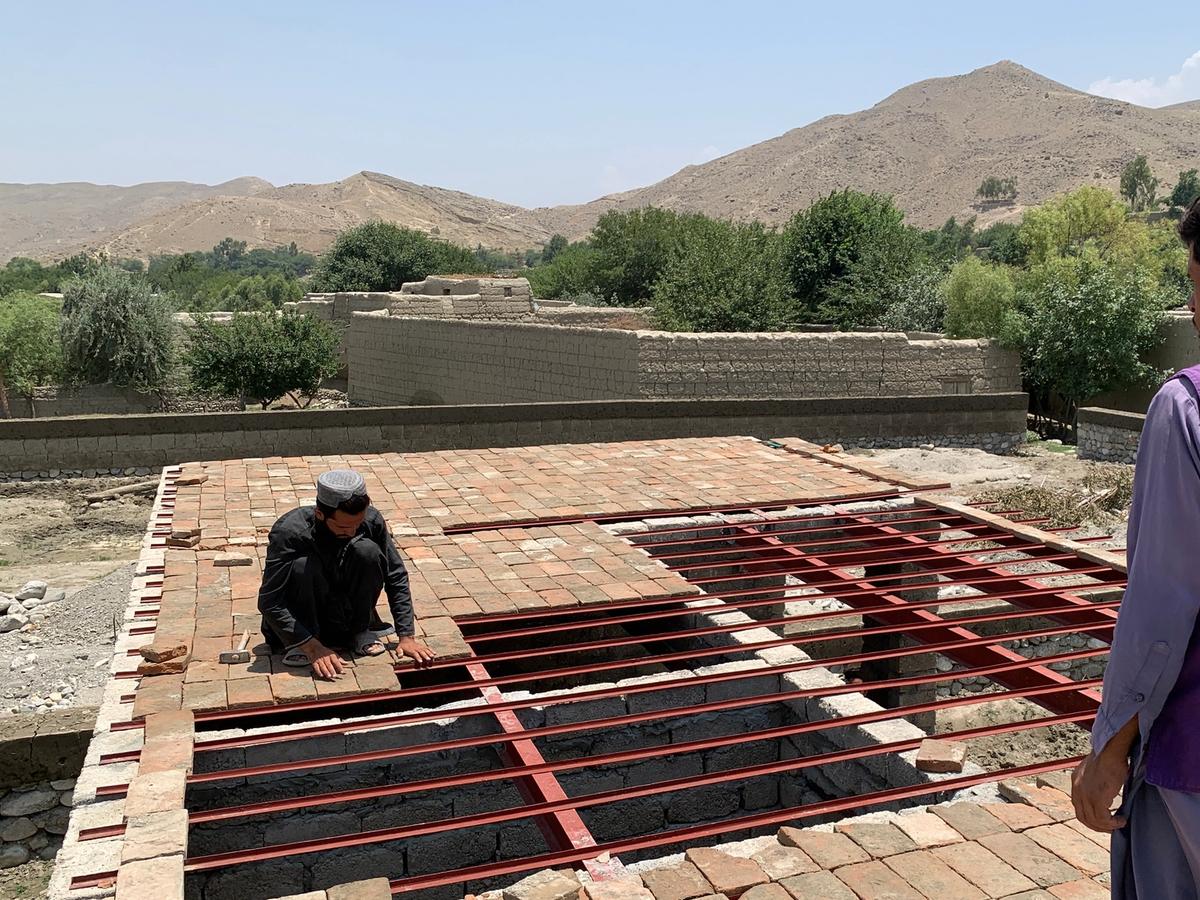 HRM Charity Aid worker helping to construct a home in Afghanistan | Human Relief Mission