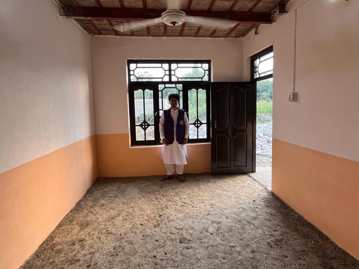 A man (HRM Aid worker) in a home in Afghanistan | Human Relief Mission