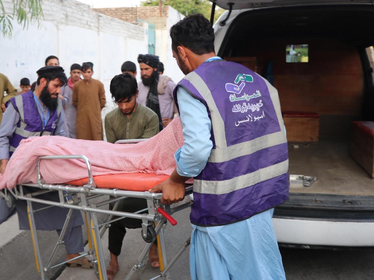An Afghan person being rescued and put onto the ambulance | Human Relief Mission