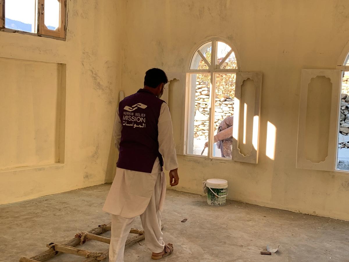 HRM Charity Aid Worker in a masjid while being structured | Human Relief Mission