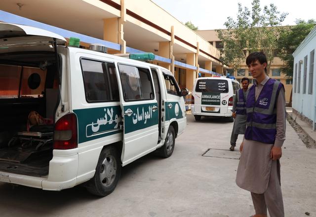 Ambulances next to HRM Aid Worker | Human Relief Mission