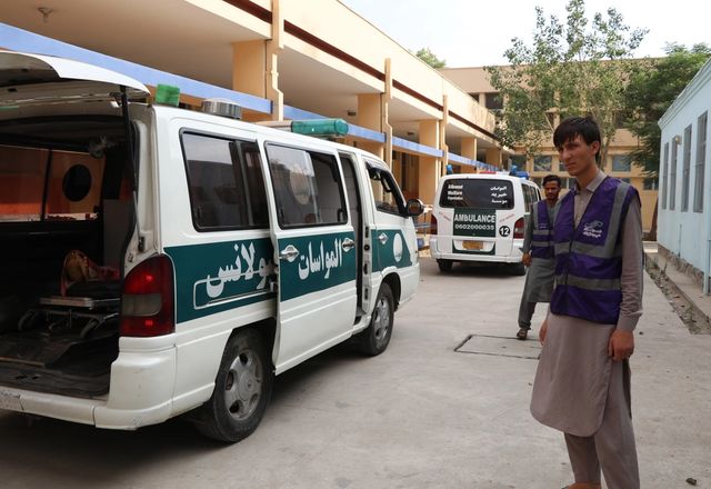 Ambulances next to HRM Aid Worker | Human Relief Mission