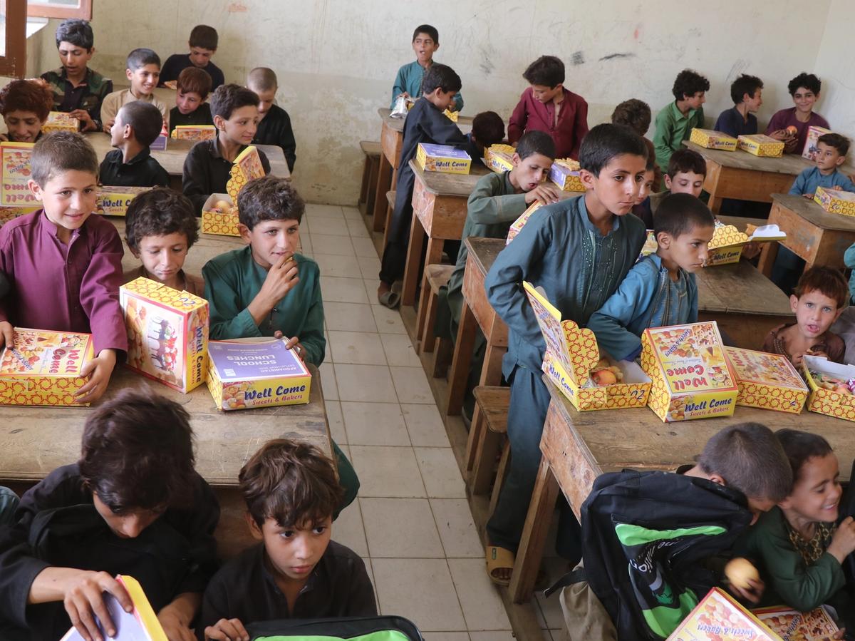 Students in Afghanistan school eating their lunch | Human Relief Mission