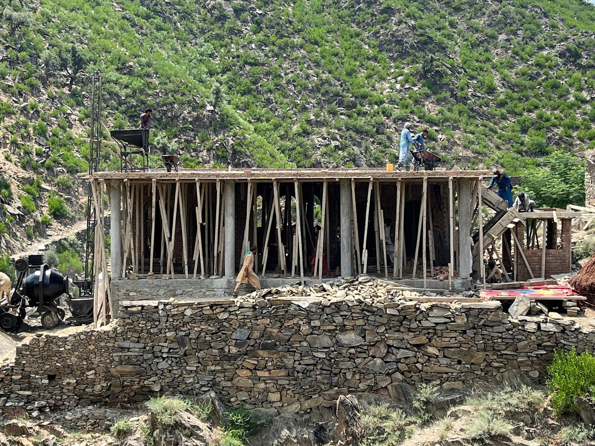 Locals in Afghanistan and HRM Charity Aid Worker constructing a masjid | Human Relief Mission