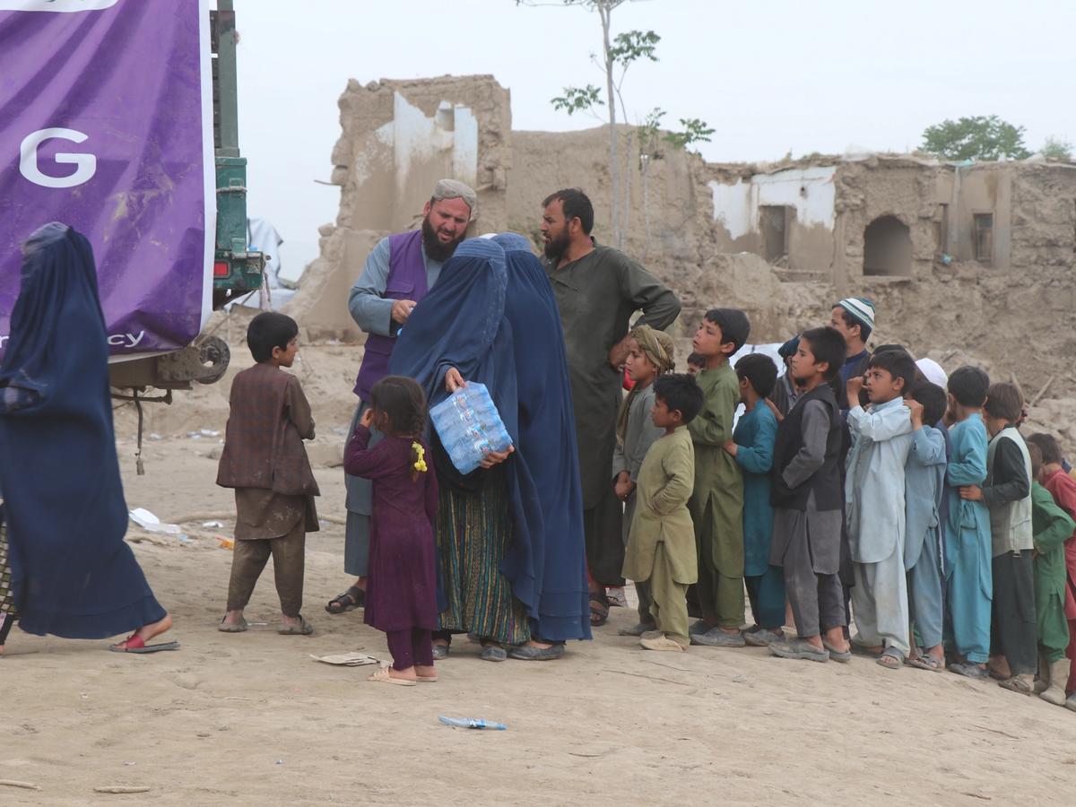 People in Afghanistan waiting for water bottles | Human Relief Mission