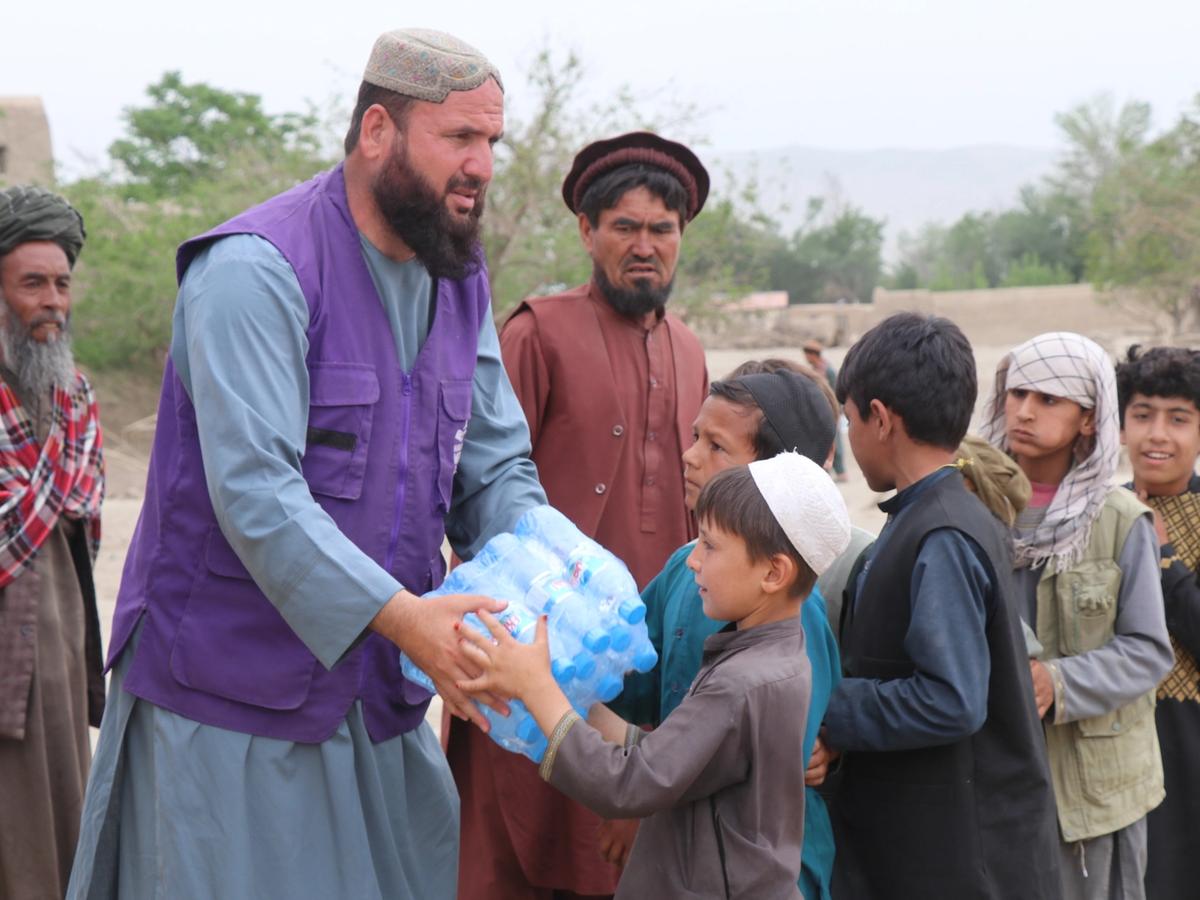 Water Bottles case given to a child in Afghanistan | Human Relief Mission