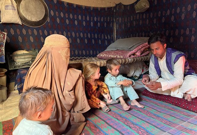 HRM Charity Aid Worker with Family in Afghanistan receiving Cash | Human Relief Mission